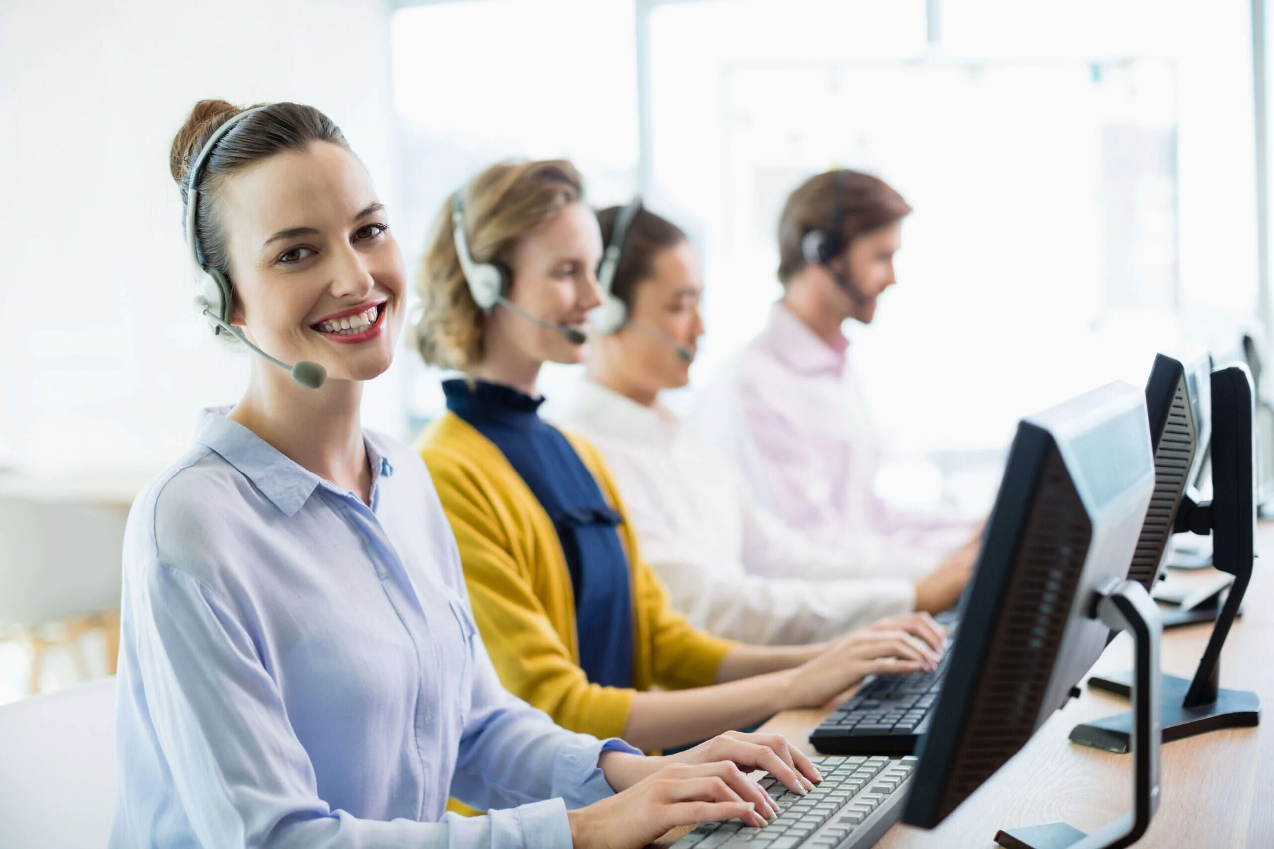 customer service executives working call center scaled